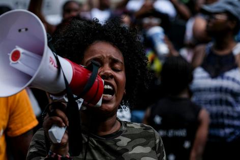 People gather outside Akron City Hall in Ohio on July 3, 2022, to protest after the release of body camera footage showed police fatally shooting Jayland Walker with several dozen rounds of bullets.
Matthew Hatcher/AFP via Getty Images