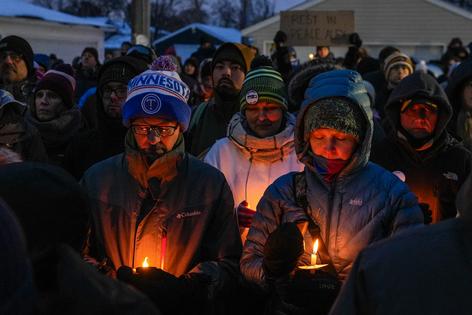 People attend a vigil for Alex Pretti, who was fatally shot by a federal immigration agent on Feb. 1, 2026, in Minneapolis.
              AP Photo/Ryan Murphy