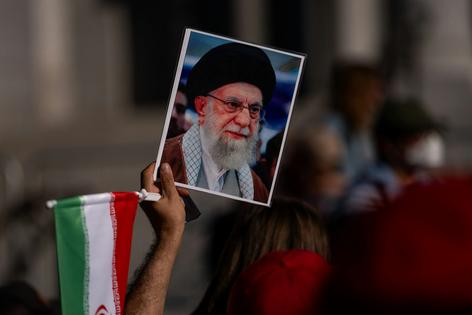 A demonstrator holds a portrait of Ayatollah Ali Khamenei in Los Angeles on Feb. 28, 2026.
Qian Weizhong/VCG via Getty Images