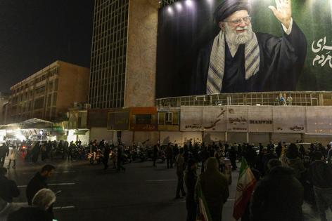 A banner with the image of Ali Khamenei during a memorial vigil in Tehran, Iran. Majid Saeedi/Getty Images