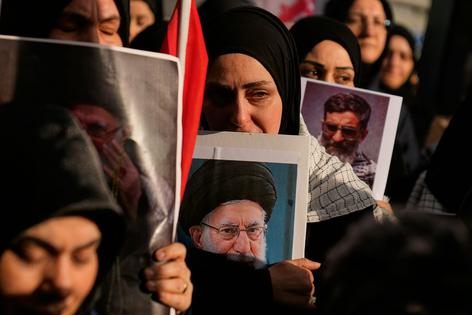 Demonstrators mourn the death of Ayatollah Ali Khamenei outside the Israeli consulate in Istanbul, on March 1, 2026.
              AP Photo/Khalil Hamra