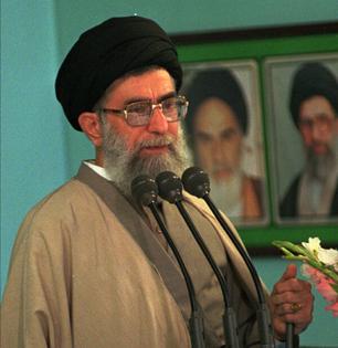 The leader of the Islamic Republic of Iran, Ayatollah Ali Khamenei, speaks at Friday prayers in Tehran on Oct. 30, 1998. Beside him is a picture of his predecessor, Khomeini.
              AP Photo/Mohammad Sayyad