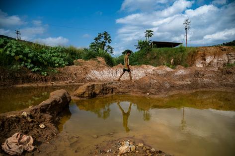 Open pit gold mines have spread across large areas of the Orinoco Mining Belt in recent years. Magda Gibelli / AFP via Getty Images