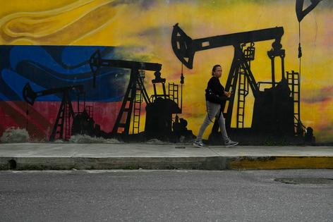 A mural in Venezuela’s capital, Caracas, reflects the country’s long reliance on the oil industry.
              AP Photo/Matias Delacroix