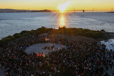 A large gathering of people celebrate Indigenous Peoples Day in 2024, by watching the Sun rise over San Francisco Bay.
Tayfun Coskun/Anadolu via Getty Images