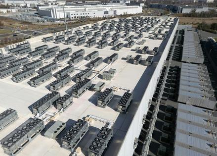 An aerial view shows cooling vent fans on the roof next to generators on the lower level of a data center in Ashburn, Va. Andrew Caballero-Reynolds/AFP via Getty Images