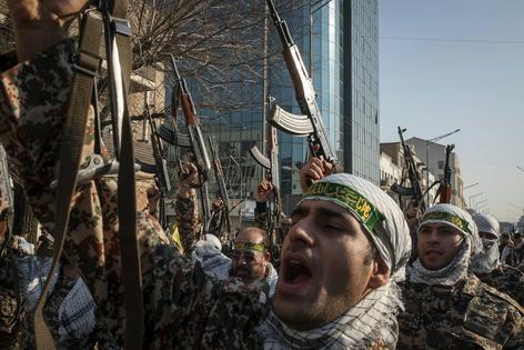 Revolutionary Guard troops march in a military rally in Tehran on Jan. 10, 2025.
              Morteza Nikoubazl/NurPhoto via Getty Images