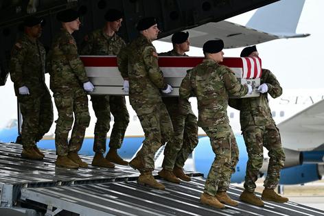 A U.S. Army carry team in Dover, Del., moves a coffin on March 7, 2026, containing the remains of a U.S. soldier killed in the retaliatory Iranian strike on Kuwait’s Port of Shuaiba.
              Kyle Mazza/Anadolu via Getty Images