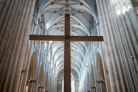 YORK, ENGLAND - MARCH 04: The Lent Cross is raised during preparations for Ash Wednesday (5 March), the start of the Lent and Easter season at York Minster on March 04, 2025 in York, England. The Lent Cross, the central symbol of the Christian Faith, is suspended from the Central Tower on Shrove Tuesday and will remain in place until The Day of Pentecost. The six-metre-tall installation is constructed from wooden scaffolding boards in the Minster's workshop. (Photo by Ian Forsyth/Getty Images)