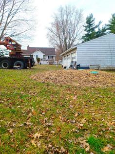 The green discs visible in the straw are service lids to a septic tank that was installed too high. As a result of this preventable error, the sewage line from the house to the tank did not have the required pitch called for in the plumbing code. (Tim Carter/Tribune Content Agency/TNS)