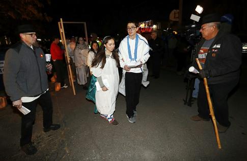Young people playing Mary and Joseph take part in ‘las posadas,’ commemorating the Christmas story’s journey to Bethlehem, at Our Lady of Visitation Church in Denver in 2018.
              AP Photo/David Zalubowski
