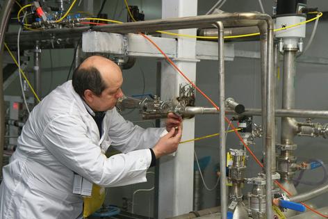 An International Atomic Energy Agency inspector works at one of Iran’s nuclear research centers in Natanz in January 2014.
              Kazem Ghane/IRNA/AFP via Getty Images