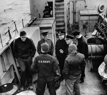 A group of press correspondents on board a U.S. landing craft en route to amphibious maneuvers off the coast of England on May 8, 1944, including, with his back to the camera on right, A.J. Liebling of The New Yorker magazine.
              AP photo