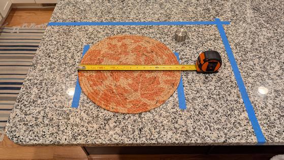 This placemat, painter's tape, a tape measure, and your island or countertop allow you to know if the vessel sink and faucet will work together. (Tim Carter/Tribune Content Agency/TNS)