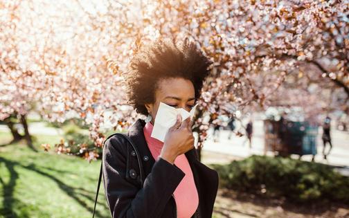 Windy days can mean more pollen and more sneezing. mladenbalinovac/E+ via Getty Images