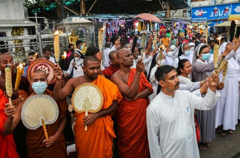 Sri Lankan civil organizations, including religious priests, protest higher electricity costs on Sept. 20, 2022, in Colombo.
              Pradeep Dambarage/NurPhoto via Getty Images