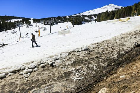Snowmaking kept slopes skiable amid high temperatures in March 2026 in Breckenridge, Colo., but it wasn’t hard to find dry, exposed land nearby.
              Michael Ciaglo/Getty Images