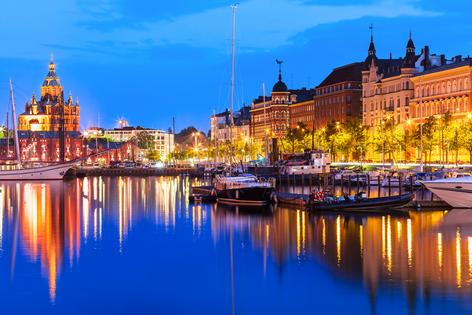 Scenic summer evening panorama of the Old Port pier architecture with tall historical sailing ships, yachts and boats and Uspenski Orthodox Cathedral in the Old Town in Helsinki, Finland. Dreamstime/TCA