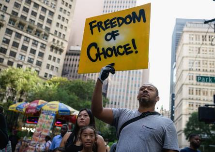 Protestors opposed to Covid-19 vaccine mandates and vaccine passports by the government rally at City Hall in New York City on August 25, 2021. (Photo by Angela Weiss / AFP) (Photo by ANGELA WEISS/AFP via Getty Images)