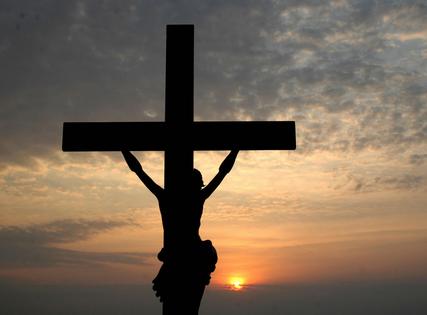 Hyderabad, INDIA: A sillouette of a depiction of the crucifixtion of Jesus Christ is seen at Wesley Church on the outskirts of Hyderabad, early 08 April 2007. Easter is an important celebration of the Christian faith commemorating the resurrection of Jesus Christ, three days after his death by crucifixion.The Resurrection of Jesus Christ is the foundation of faith and hope. AFP PHOTO/NOAH SEELAM (Photo credit should read NOAH SEELAM/AFP via Getty Images)