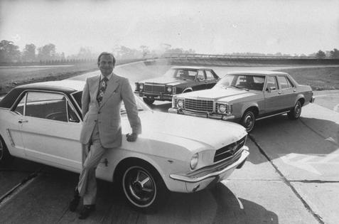 Ford Motor Co. President Lee Iacocca leans against a Ford Mustang in Bloomfield Hills, Mich., in 1974.
John Olson/Getty Images