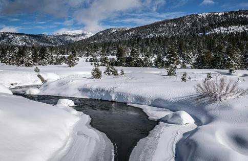 In a good year, the West's mountain snowpack feeds streams and rivers well into summer. George Rose/Contributor/Getty Images News