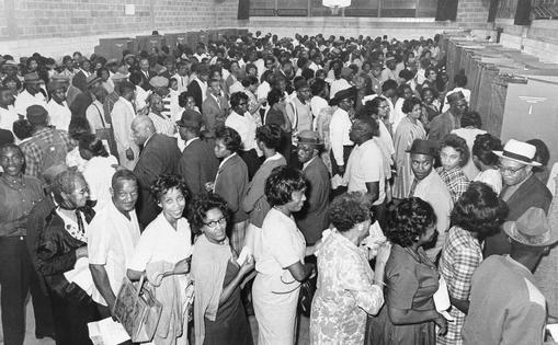 An estimated 1,000 Black Americans wait to vote in the Democratic primary in Birmingham, Ala., on May 3, 1966, the first major Southern election after passage of the 1965 federal Voting Rights Act.
              AP Photo