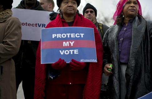People wait in line outside the Supreme Court on Feb. 27, 2013, to listen to oral arguments in the Shelby County v. Holder voting rights case.
              AP Photo/Evan Vucci
