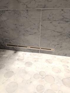 This narrow slot is connected to a high-speed fan that blows air into a shower. The air removes the water, stopping the growth of mold and mildew. (Tim Carter/Tribune Content Agency)