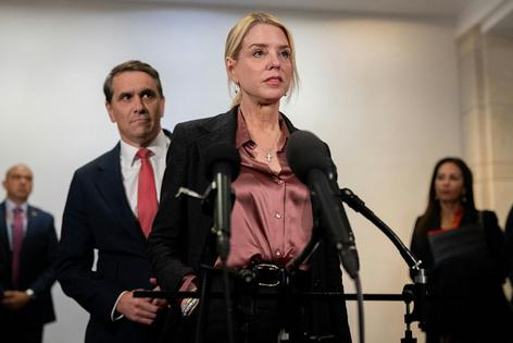 Attorney General Pam Bondi and Deputy Attorney General Todd Blanche speak to reporters in Washington on March 18, 2026.
              Nathan Posner/Anadolu via Getty Images