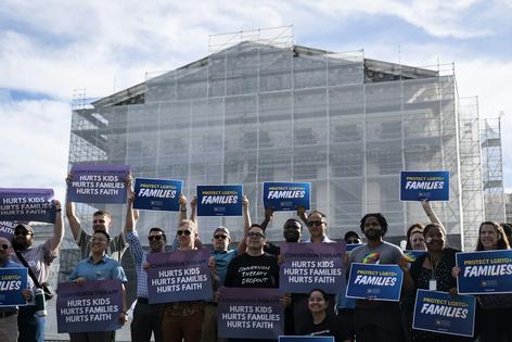 Demonstrators with the Human Rights Campaign stand outside the United States Supreme Court during oral arguments in October 2025. The court released its decision on a free speech challenge to a ban on conversion therapy on March 31, 2026.
              Jabin Botsford/The Washington Post via Getty Images
