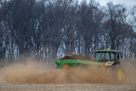 Fertilizer scarcity and costs are just the beginning of the problems. Jim Watson/AFP via Getty Images