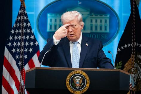 President Donald Trump mimics an Iranian protester being shot while holding a news conference in the White House on April 6, 2026. Tom Williams/CQ-Roll Call, Inc via Getty Images