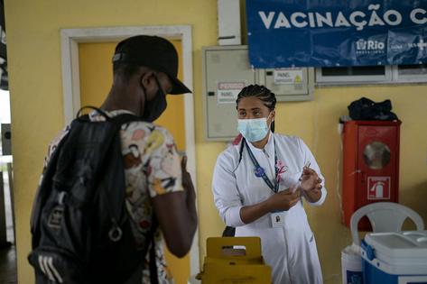 A long-term investment in building trust in public health helped fuel the groundswell of support for COVID-19 vaccine efforts.
              Mauro Pimentel/AFP via Getty Images