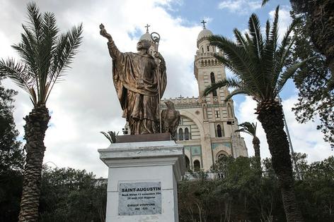 A statue of St. Augustine stands outside the St. Augustine Basilica in the eastern Algerian city of Annaba on March 28, 2026.
              AFP via Getty Images