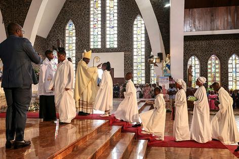 Archbishop of Yaounde Jean Mbarga blesses worshippers during Easter Mass at Notre Dame des Victoires Cathedral in Yaounde, Cameroon, on April 5, 2026.
              Daniel Beloumou Olomo/AFP via Getty Images