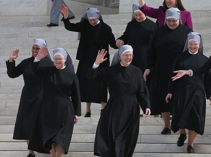 WASHINGTON, DC - MARCH 23: Mother Loraine Marie Maguire, (C), of the Little Sisters of the Poor, walks down the steps of the US Supreme Court after arguments, March 23, 2016 in Washington, DC. The high court heard arguments in Little Sisters v. Burwell, which will examine whether the governments new health care regulation will require the Little Sisters to change their healthcare plan, to other services that violate Catholic teaching. (Photo by Mark Wilson/Getty Images)