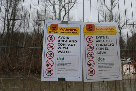 When sewage spills happen, signs warn the public in clear terms about the danger.
              Heather Diehl/Getty Images