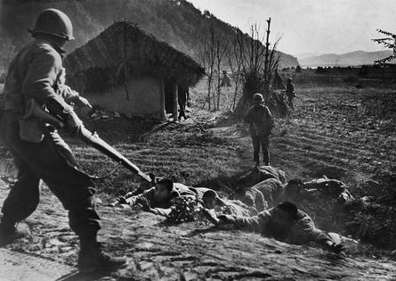U.S. soldiers in 1951 order Chinese prisoners to the ground outside Seoul, South Korea, before U.S. and U.N. troops took the city.
              AFP via Getty Images