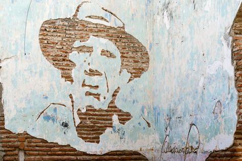 A portrait of Julio Antonio Mella is seen chiseled from a brick wall in Camaguey, Cuba.
              Roberto Machado Noa/LightRocket via Getty Images