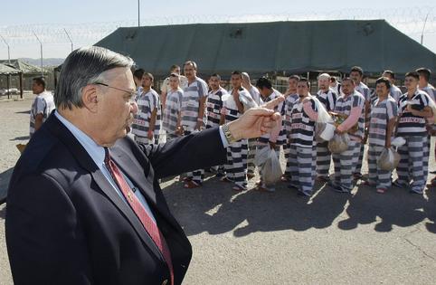Maricopa County Sheriff Joe Arpaio orders undocumented immigrants handcuffed together and moved into a separate area of Tent City in Phoenix on Feb. 4, 2009. AP Photo/Ross D. Franklin, File