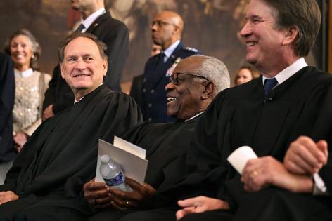 Supreme Court Justices Samuel Alito and Clarence Thomas share a laugh at the U.S. Capitol on Jan. 20, 2025. Chip Somodevilla/Getty Images
