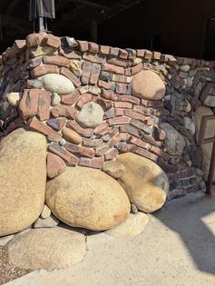 This is a small brick and stone retaining wall. The mason used some factory-reject bricks to create it. It’s also possible these curved and twisted bricks were made on purpose. (Tim Carter/Tribune Content Agency/TNS)