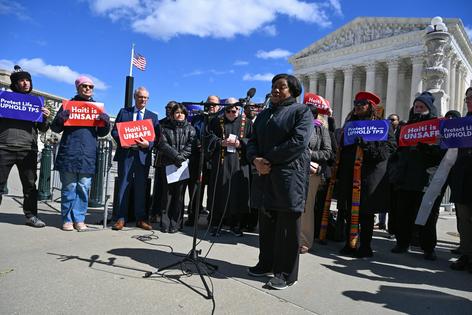 Advocates for Haitians holding temporary protected status appear at a press conference on March 16, 2026, in front of the Supreme Court, which has agreed to rule through its shadow docket on whether they can remain in the U.S.
              Roberto Schmidt/AFP via Getty Images
