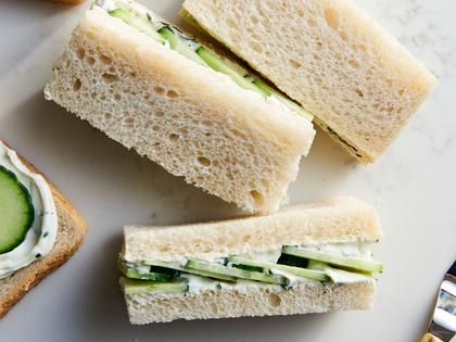 Tea sandwiches made with thinly sliced cucumber, fresh herbs, and seasoned cream cheese are perfect for any gathering. (Joe Lingeman/TCA)