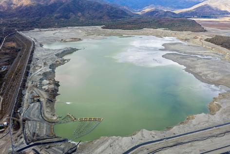 Copper-mining companies create huge tailings ponds, like this one in Chile in 2019, to store toxic byproducts of mining. Hundreds of these waste ponds exist across the country and carry the risk of leaking acidic water and heavy metals such as arsenic, copper and mercury into groundwater.
              Martin Bernetti/AFP via Getty Images