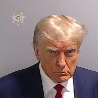 In this handout provided by the Fulton County Sheriff’s Office, former U.S. President Donald Trump poses for his booking photo at the Fulton County Jail on Aug. 24, 2023, in Atlanta, Ga.
              Fulton County Sheriff's Office via Getty Images