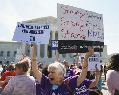 An abortion rights supporter protests outside the Supreme Court building in 2018, when the court heard a different crisis pregnancy center case.
              AP Photo/Carolyn Kaster