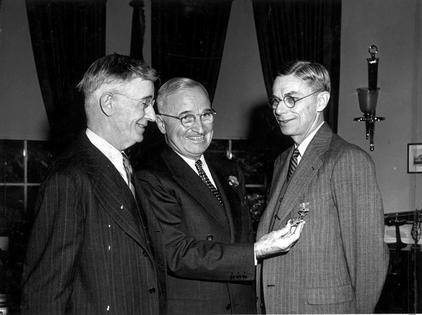 Vannevar Bush, left, played a key role in the creation of the National Science Foundation, which President Harry Truman, center, ultimately ratified after an initial veto.
              Abbie Rowe/National Park Service via Wikimedia Commons
