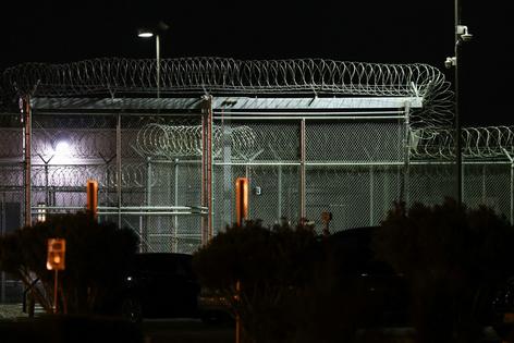 Barbed wire surrounds the GEO Group ICE detention facility in Adelanto, Calif. on July 10, 2025.  Patrick T. Fallon/AFP via Getty Images